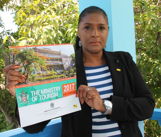 Shelagh James, Communications officer in the Ministry of Tourism on Nevis with a copy of the ministry’s 2017 calendar